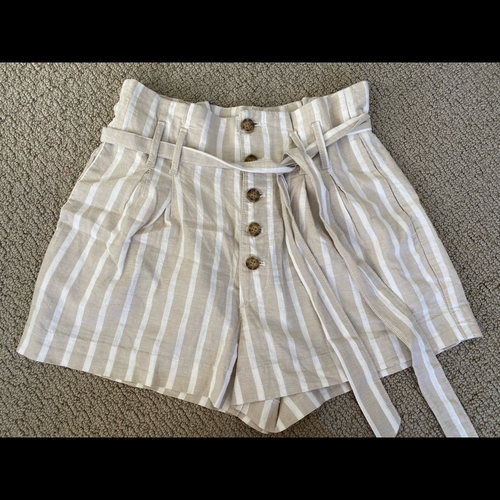 High-waisted paper bag shorts.